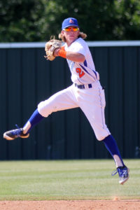 Angelina College shortstop Tony Lima goes airborne to make a throw from deep in the hole during Friday’s game against Paris College at Roadrunner Field. The Dragons held off AC 8-5 in the opening game of a series scheduled to resume on Saturday. (AC Press photo by Gary Stallard)