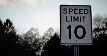 SPEED LIMIT SIGNS BEING MOVED ON SH 21 WEST