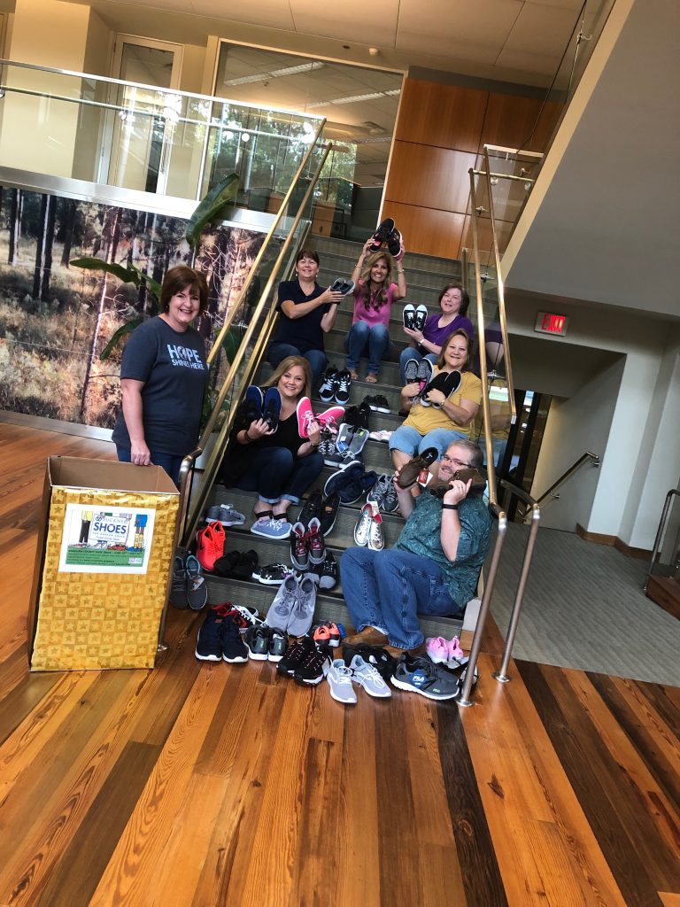 Employees Collect Shoes for Needy Angelina