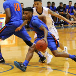 Corinthian Ramsey (0) of Angelina College drives past Cedar Valley’s Jordan Evans during Saturday’s game at Shands Gymnasium. The Roadrunners used a big second-half push to take a 98-82 win over the Suns in the final day of the Guy Davis/Coca Cola Thanksgiving Classic. (AC Press photo by DeShun Pham-Adams)