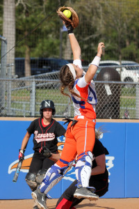 Angelina College catcher Heather Kulhanek makes a leaping grab of a throw home during Wednesday’s doubleheader against Navarro College. The No. 10 Lady Roadrunners took a 6-4 win in the late game after dropping the opener by a 7-1 score. (AC Press photo)