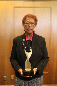 Dr. Patricia Mackenzie receives the 2016 Athena Award during the Women's Networking Luncheon held Friday, April 15, 2016.  (Photo by Victoria Charanza)