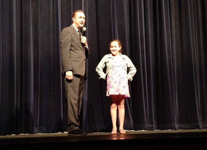 Wes Miller provides entertainment during the Spring Concert while different bands were setting up and tearing down equipment. 