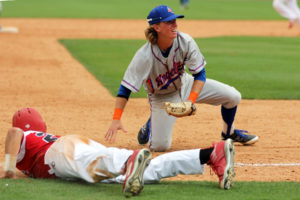 Angelina College shortstop Tony Lima (2) looks to the ump for a call after his diving tag on a Wharton College runner during Friday’s Region XIV Conference Tournament game. The Roadrunners fell into Saturday’s elimination bracket with an 11-8 loss to the Pioneers in Sugar Land. (AC Press photo by Gary Stallard)