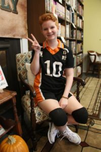 Megan Harbuck, and employee at Absolutely Fiction Books, dressed as Hinata Shouyou from the manga "Haikyu!!" for work Thursday, Oct. 27.